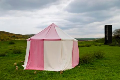 Dramatic clouds and an ancient camp, restored from medieval time Stock Photos