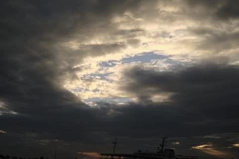 Dramatic clouds and a beautiful sunset Stock Photos