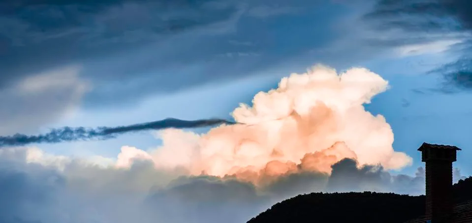 Dramatic clouds and deep blue sky Stock Photos