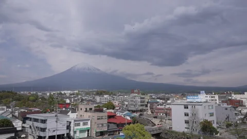 Dramatic Clouds and flying bird top Mount Fuji and Fujinoma City in Japan Stock Footage 242423006