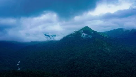 Dramatic Clouds and Fog Passing Over Tropical Mountain Chain 動画素材 79420536