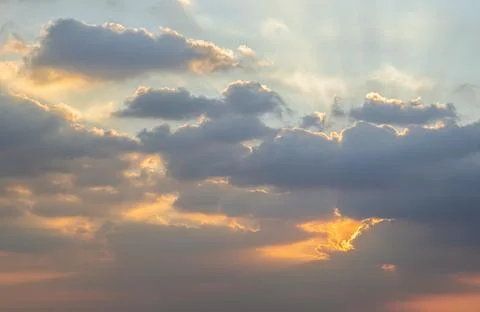 Dramatic clouds and shining form an interesting light pattern against the s.. Foto stock