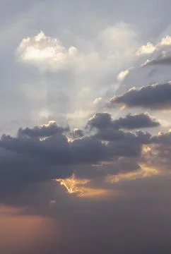 Dramatic clouds and shining form an interesting light pattern against the s.. 写真素材