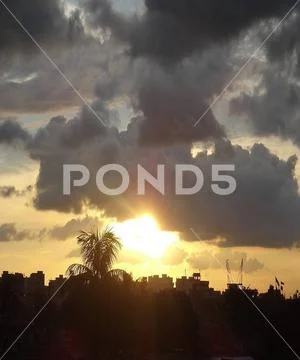 Dramatic clouds and the sun Stock Photos