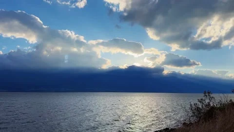 Dramatic Clouds and Sun Rays Over Erhai Lake in Dali, Yunnan at Sunset Stock-Footage 337912813