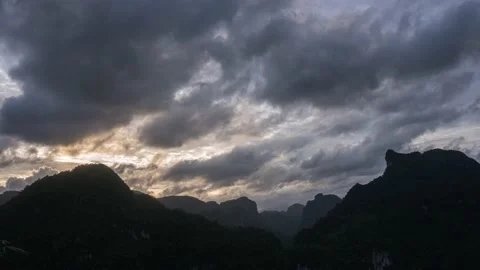 Dramatic clouds and sunbeam over mountains peak. Getting dark Stock Footage 205251485