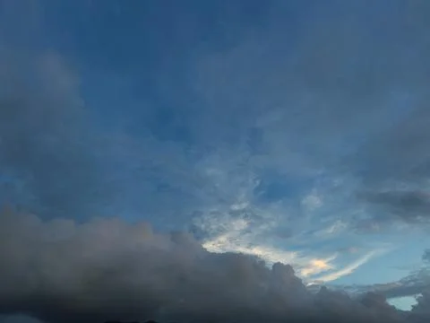 Dramatic Clouds in a Blue Evening Sky Stock Photos