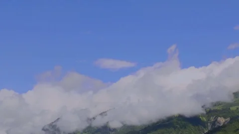 Dramatic Clouds with Blue Sky in the Swiss Alps Stock Footage 78599430