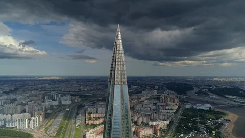 Dramatic clouds cityscape Petersburg modern skyscraper tallest Europe sharp top Stock Footage 128620848