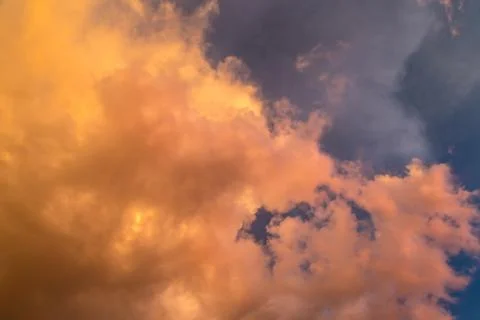 Dramatic clouds at colourful moody sunset Stock Photos