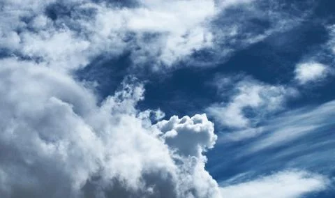 Dramatic clouds on dark blue sky Stock Photos