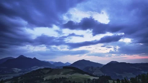 Dramatic clouds at dusk, bitter hilly rural landscape in the Carpathians 動画素材 247112821