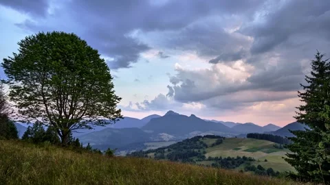 Dramatic clouds at dusk, rural hilly landscape in the Carpathians, scene with Stock Footage 247113102