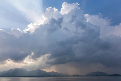 Dramatic clouds early in the morning. View to a tropical island Stock Photos