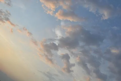 Dramatic clouds in the eastern sky with the sun rises behind it Stock Photos