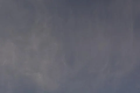 Dramatic clouds in the eastern sky with the sun rises behind it Foto stock