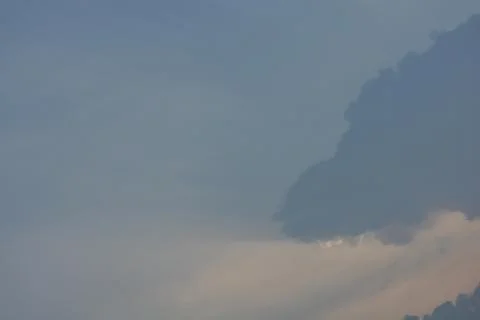 Dramatic clouds in the eastern sky with the sun rises behind it Stock Photos