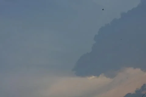 Dramatic clouds in the eastern sky with the sun rises behind it Stock Photos