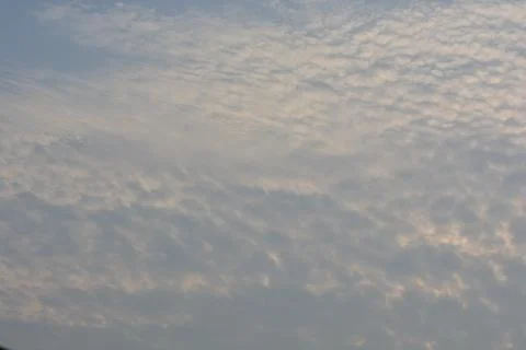 Dramatic clouds in the eastern sky with the sun rises behind it Stock Photos