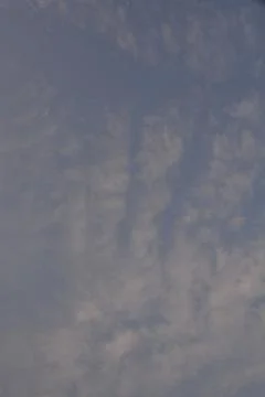 Dramatic clouds in the eastern sky with the sun rises behind it Stock Photos
