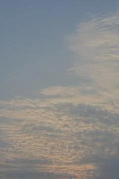 Dramatic clouds in the eastern sky with the sun rises behind it Stock Photos