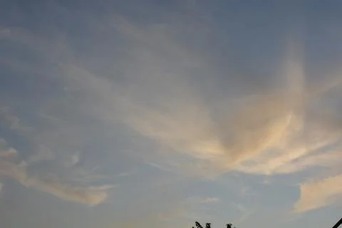 Dramatic clouds in the eastern sky with the sun rises behind it Stock Photos