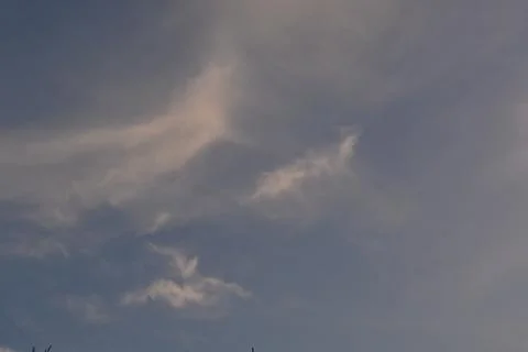 Dramatic clouds in the eastern sky with the sun rises behind it Stock Photos