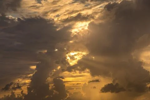Dramatic clouds in the evening with sun rays Stock Photos