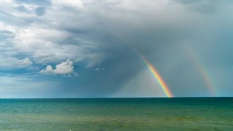 Dramatic clouds float over the coast of the Azov Sea Stock Photos