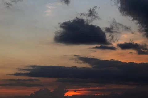 Dramatic Clouds Gathering at Sunset with Natural Light and Vibrant Colors for 写真素材