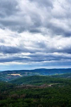 Dramatic Clouds hanging over Harz Mountains Stock Photos