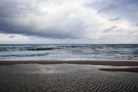 Dramatic clouds on the horizon looking out over the sea Stock Photos