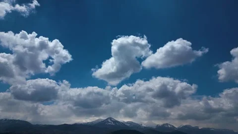Dramatic Clouds Hyperlapse Over Snow-Capped Mountain Range at Daytime Stock-Footage 334318093