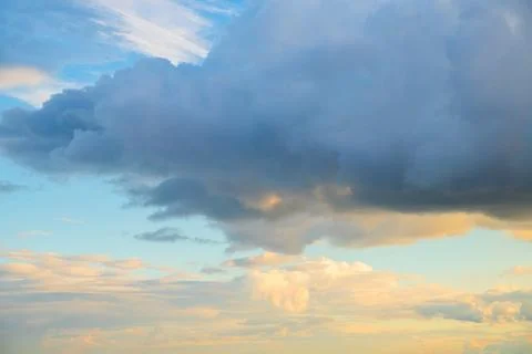 Dramatic clouds illuminated by sunset light create a stunning sky Foto stock
