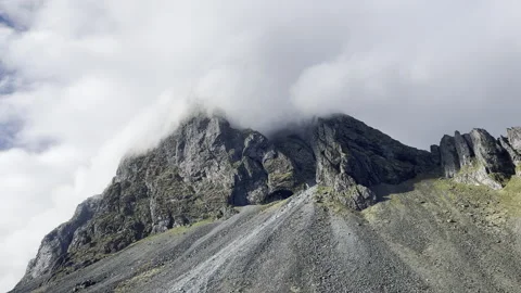Dramatic clouds mist over mountain with movement Iceland 4k hdr Stock Footage 279340087