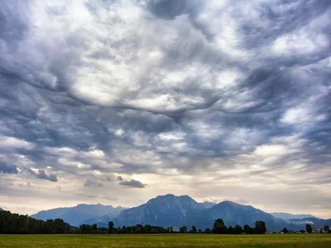 Dramatic clouds in the mountain valley 스톡 사진