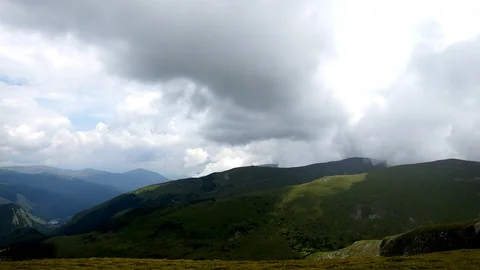 Dramatic clouds on mountains timelapse Stock Footage 99429860