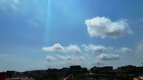 Dramatic Clouds Moving Across Blue Sky Over Urban Landscape Timelapse 4K Stock Footage 342343987