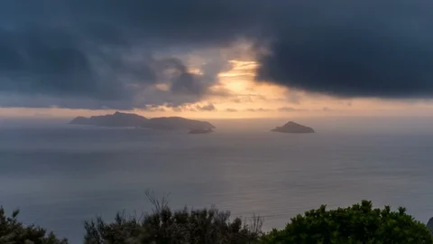 Dramatic clouds moving fast over ocean and small island Time lapse Stock Footage 104591905
