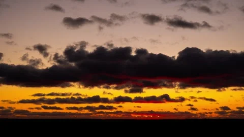 Dramatic Clouds Moving Over Fiery Sunset Sky Timelapse Stock Footage 324995821