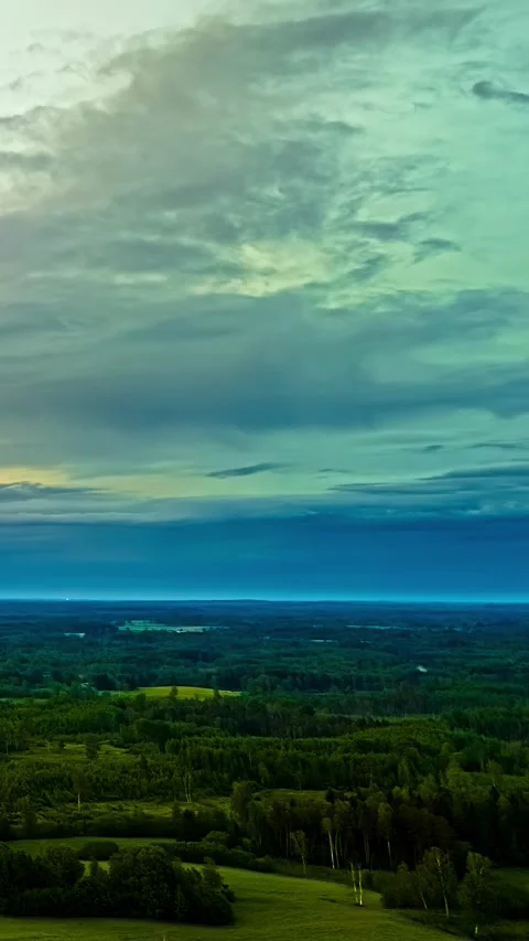 Dramatic Clouds Moving Over Lush Green Forest in Vertical Timelapse Landscape Stock Footage 340565806