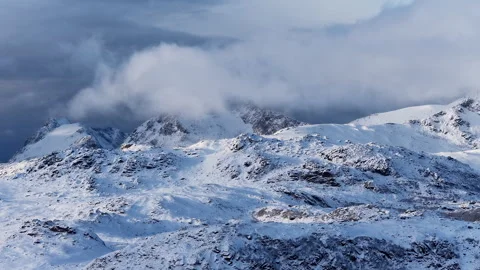 Dramatic clouds moving over snowy mountain peaks, Norway Stock-Footage 342921153