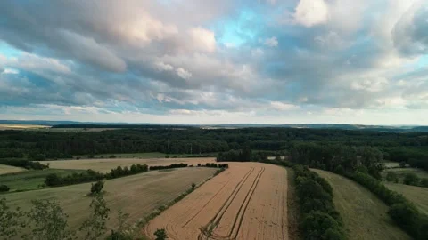 Dramatic clouds moving slowly over fields Stock Footage 245062227