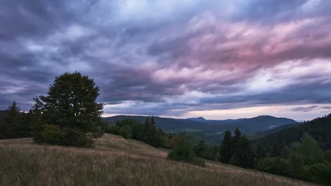 Dramatic clouds over an autumn landscape with forests and meadows. Video stock 217909767