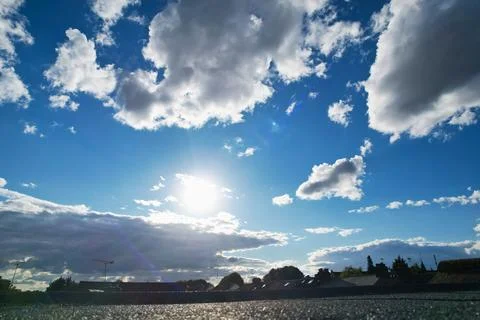 Dramatic Clouds over Blue Sky at British City of England UK Weather Stock Photos
