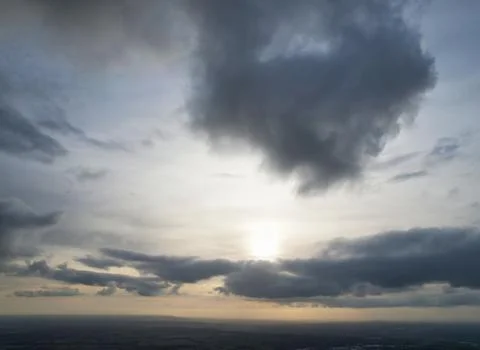 Dramatic Clouds over Blue Sky at British City of England UK Weather Stock Photos