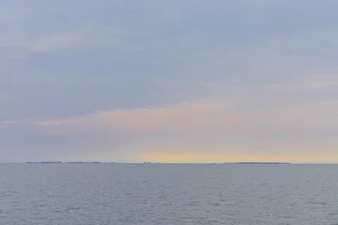 Dramatic clouds over the Chesapeake Bay at sunset. Stock Photos