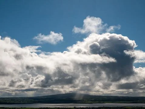 Dramatic Clouds Over Coastal Landscape Foto stock