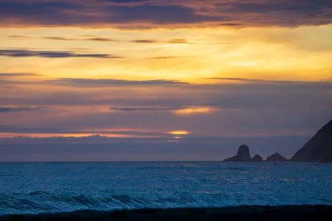 Dramatic Clouds over a dark ocean Stock Photos