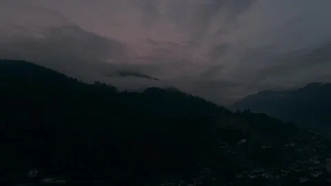 Dramatic clouds over forested slopes Stock Footage 328338094